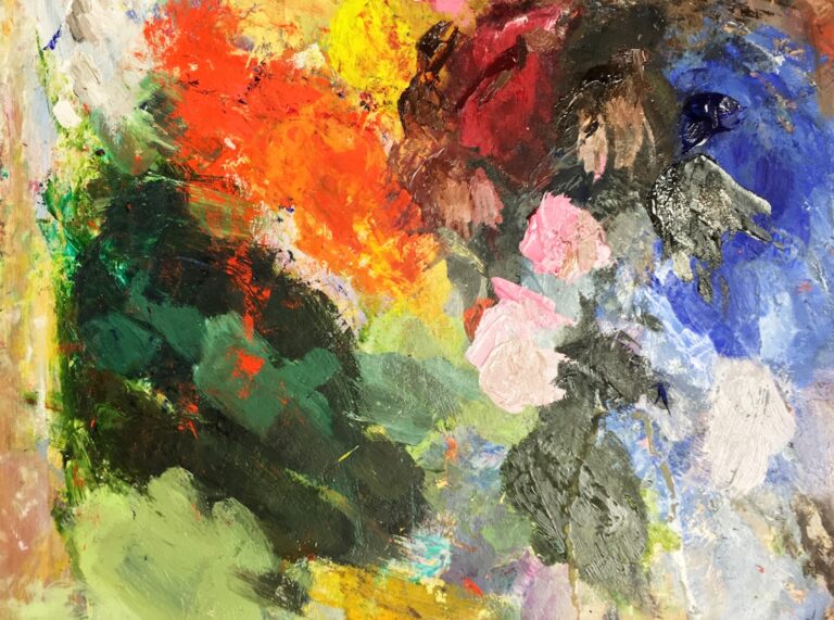 Paleta de artista com respingos de tinta em várias cores misturadas